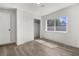 Bedroom featuring a closet and a window providing natural light and wood-look flooring at 2729 Flower Ave, North Las Vegas, NV 89030