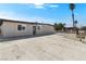 View of single-story house with large front yard including secure fencing and a spacious driveway at 2729 Flower Ave, North Las Vegas, NV 89030
