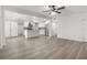 Bright, open concept living space flows seamlessly into a modern, white kitchen with stainless appliances at 2729 Flower Ave, North Las Vegas, NV 89030