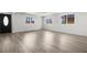 Bright open living space showcasing wood-look floors, abundant natural light, and a welcoming atmosphere at 2729 Flower Ave, North Las Vegas, NV 89030