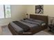 Staged bedroom with modern furniture, neutral tones, and ample natural light at 2736 Darby Falls Dr, Las Vegas, NV 89134