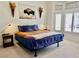 Bright bedroom featuring a stylish bed, side tables, and windows with plantation shutters at 2736 Darby Falls Dr, Las Vegas, NV 89134
