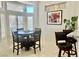 Cozy breakfast nook with a round table and comfortable chairs, illuminated by natural light at 2736 Darby Falls Dr, Las Vegas, NV 89134