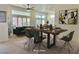 Dining room with modern table setting and view into the living room at 2736 Darby Falls Dr, Las Vegas, NV 89134