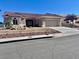 Single-story home with desert landscaping, a tile roof, and a two-car garage at 2736 Darby Falls Dr, Las Vegas, NV 89134