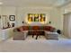 Comfortable living room features a large sectional sofa, stylish artwork, and neutral decor at 2736 Darby Falls Dr, Las Vegas, NV 89134