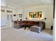 Spacious living room with neutral carpet, a sectional sofa, and ample natural light at 2736 Darby Falls Dr, Las Vegas, NV 89134