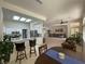 Open concept living space that flows from dining into kitchen to living room at 2736 Darby Falls Dr, Las Vegas, NV 89134