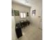 Home office space with natural light, tiled floor, and neutral paint at 2736 Darby Falls Dr, Las Vegas, NV 89134