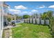 Expansive backyard with lush lawn, hardscape area, and lovely landscaping at 2875 Cooper Creek Dr, Henderson, NV 89074