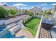 Backyard with a pool, white fences, trees and shrubs at 2875 Cooper Creek Dr, Henderson, NV 89074