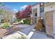 Charming front exterior with brick accents, mature landscaping, and a welcoming entrance at 2875 Cooper Creek Dr, Henderson, NV 89074