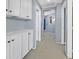 Neutral hallway with storage, carpet, and access to other rooms at 2875 Cooper Creek Dr, Henderson, NV 89074
