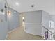 Upstairs hallway featuring neutral walls, carpet, and white railing overlooking the entry at 2875 Cooper Creek Dr, Henderson, NV 89074