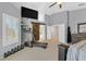Main bedroom features a large window, a sliding barn door to the bathroom, and a treadmill at 2875 Cooper Creek Dr, Henderson, NV 89074