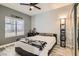 Bedroom with a Raiders theme, featuring a double bed, desk, shelving, and natural light from a window at 2975 Bluegrass Ln # 412, Henderson, NV 89074
