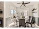 Bright dining area with a modern table, sleek chairs, and large windows with neighborhood scenery at 2975 Bluegrass Ln # 412, Henderson, NV 89074