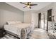 Serene bedroom with a comfortable bed, dresser, neutral color palette, and sliding glass doors to a balcony at 2975 Bluegrass Ln # 412, Henderson, NV 89074
