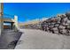 This backyard includes a covered patio and rock wall, providing a private outdoor space at 352 Sidewheeler St, Henderson, NV 89012