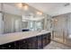 The primary bathroom features a luxurious soaking tub and tiled shower at 352 Sidewheeler St, Henderson, NV 89012