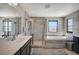 Primary bathroom showcasing a sleek shower and tub with a mountain view at 352 Sidewheeler St, Henderson, NV 89012