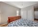 This bedroom features a wooden sleigh bed, a sliding door closet, and neutral paint at 352 Sidewheeler St, Henderson, NV 89012