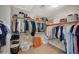 Walk-in closet features built-in shelving and hanging rods for optimal storage and organization at 352 Sidewheeler St, Henderson, NV 89012