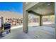 Relaxing covered patio features stone accent walls and recessed lighting for outdoor living at 352 Sidewheeler St, Henderson, NV 89012