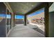Spacious outdoor patio with sliding glass doors and stone accent wall, great for entertaining at 352 Sidewheeler St, Henderson, NV 89012