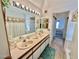 Bathroom with a dual sink vanity, large mirror and shower tub combination at 3550 Bay Sands Dr # 3089, Laughlin, NV 89029