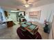 Bright dining area with a glass-top table set for four, next to the modern kitchen at 3550 Bay Sands Dr # 3089, Laughlin, NV 89029