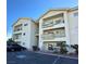 Inviting condo complex featuring balconies, well-maintained landscaping, and ample parking at 3550 Bay Sands Dr # 3089, Laughlin, NV 89029