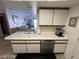 The kitchen features a breakfast bar with a double sink, and stainless steel dishwasher at 3550 Bay Sands Dr # 3089, Laughlin, NV 89029