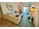 Cozy living room with plush seating, fireplace, and sliding glass door to outdoor patio at 3550 Bay Sands Dr # 3089, Laughlin, NV 89029