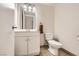 Clean bathroom with white vanity, toilet, and updated mirror lighting at 3577 Wayne Cir, Las Vegas, NV 89121