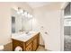 Bathroom featuring a wood vanity with large mirror, lighting fixture, and a toilet at 3577 Wayne Cir, Las Vegas, NV 89121