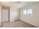 Bedroom featuring carpet floors, closet with sliding doors, and a bright window at 3577 Wayne Cir, Las Vegas, NV 89121