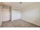 Carpeted bedroom featuring sliding door closet, window, and neutral paint at 3577 Wayne Cir, Las Vegas, NV 89121