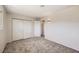A bright bedroom features neutral paint, carpet, large closet, and updated light fixture at 3577 Wayne Cir, Las Vegas, NV 89121