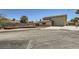 Exterior view of a two-story home with desert landscaping, attached garage, and a well-maintained front yard at 3577 Wayne Cir, Las Vegas, NV 89121