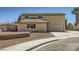 Two-story home featuring a large front yard, a two car garage, and desert landscaping with curb appeal at 3577 Wayne Cir, Las Vegas, NV 89121