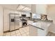 Updated kitchen with stainless steel appliances, granite countertops, modern cabinets, and tile flooring, offering both style and functionality at 3577 Wayne Cir, Las Vegas, NV 89121