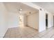 Open-concept living area flowing into a kitchen with tile floors and neutral paint at 3577 Wayne Cir, Las Vegas, NV 89121