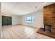 Bright living room with tile floors and a cozy brick fireplace at 3577 Wayne Cir, Las Vegas, NV 89121