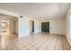 Spacious living area with tile flooring, neutral walls, and a view of the kitchen at 3577 Wayne Cir, Las Vegas, NV 89121