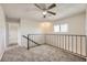 Upstairs loft area with carpet, window and staircase access, perfect for entertaining or relaxing at 3577 Wayne Cir, Las Vegas, NV 89121