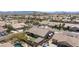 Expansive aerial view of the property showcasing a large lot, landscaped backyard with pool and putting green at 3662 Riley Ann Ave, Las Vegas, NV 89139