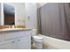 Bathroom with granite counters, tile flooring, and a shower-tub combo at 3662 Riley Ann Ave, Las Vegas, NV 89139