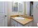 Bright bathroom featuring granite countertop vanity with sink and mirror at 3662 Riley Ann Ave, Las Vegas, NV 89139