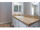 Bathroom features granite countertops, white cabinets, and a clean, modern design at 3662 Riley Ann Ave, Las Vegas, NV 89139